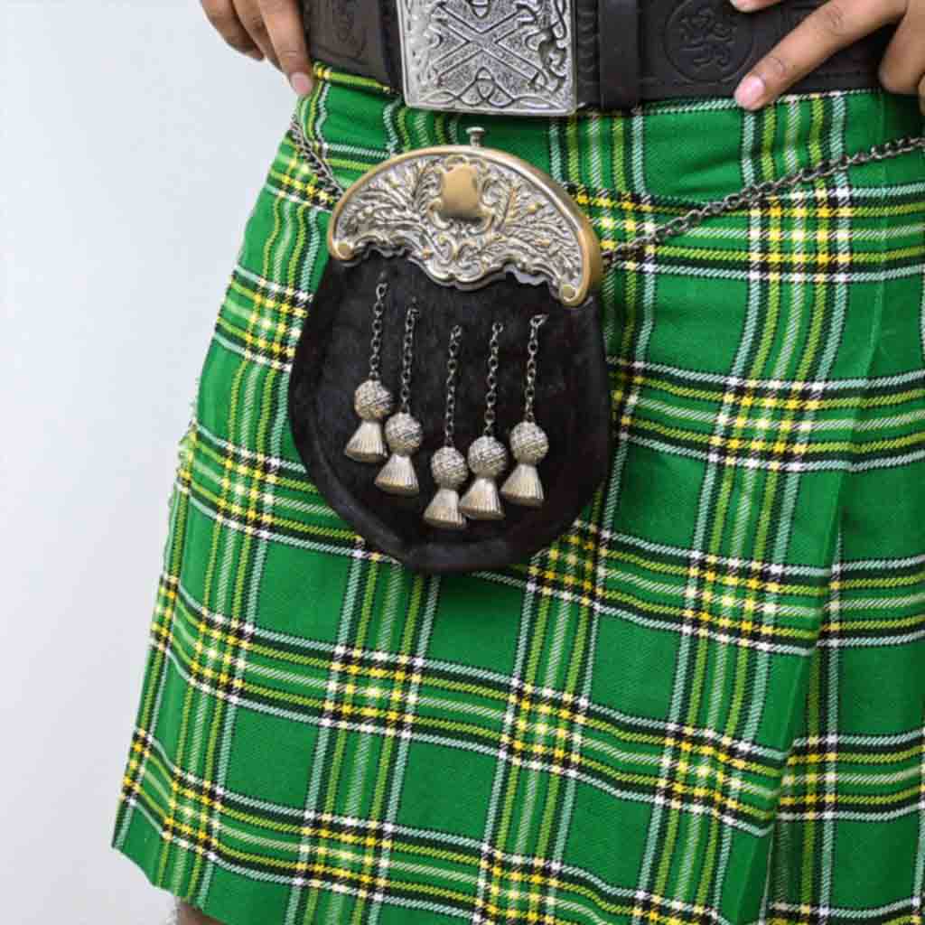 Scottish kilt sporran made of leather and black fur with metal tassels