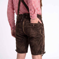 Men wearing dark brown leather or suede lederhosen shorts with suspenders, paired with a red and white gingham shirt, shown from the back against a plain white background.