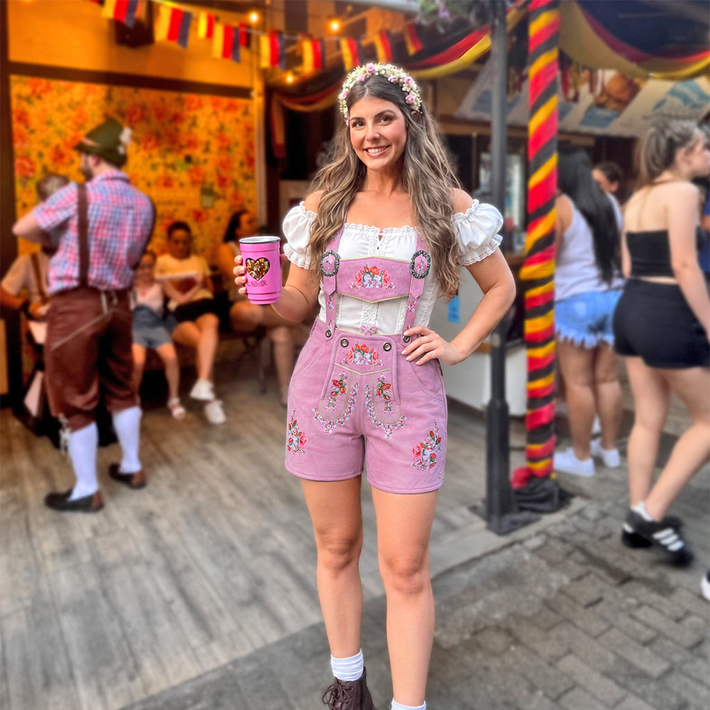 Model wearing Womens Oktoberfest Outfit Lederhosen Suede Leather Oktoberfest Dress Rose Pink at German beer festival