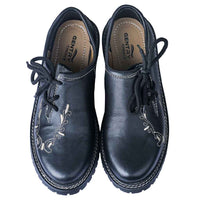 Pair of men's Oktoberfest shoes in black cowhide leather with tan embroidery, viewed from above