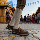 Side view of Model wearing Suede Leather Oktoberfest shoes, dark brown 
