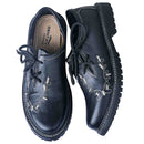 Top-down view of Gentry Choice Bavarian shoes showing branded insole and embroidered toe design