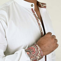Close-up of traditional Bavarian shirt collar less embroidery detail on collar and cuff