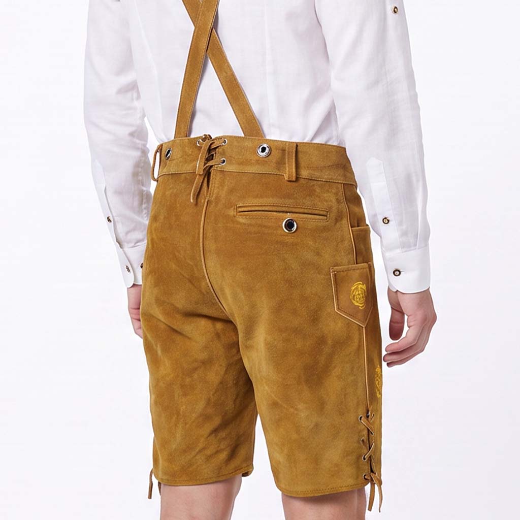A person wearing tan suede-like suspenders shorts with lace-up sides and a white long-sleeve shirt, shown from the back against a plain white background.