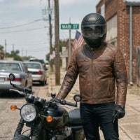 Front view of RIDERACT brown leather motorbike jacket with protective riding features