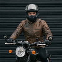 RIDERACT leather motorcycle jacket lifestyle image with rider and motorcycle