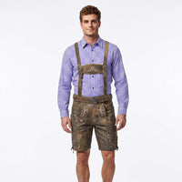 A man modeling traditional Bavarian-style lederhosen shorts with suspenders, worn over a blue and white checkered shirt, on a solid white background.