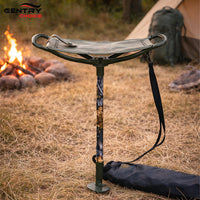Man using Gentry Choice walking stick with seat while outdoors near campfire